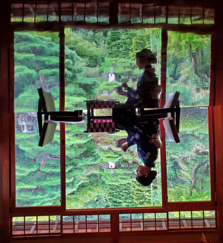 Nao-san enjoys tea at Kyutei Omuro...her reflection caught in the polished table.