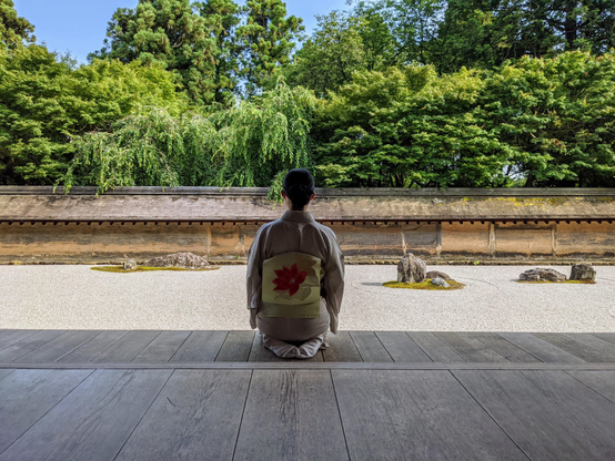 Nao-san contemplates the zen garden at Ryoan-ji.