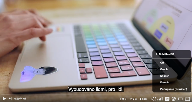 a still image from my fedi intro video that shows an open laptop... there are Czech subtitles on and a pop up menu on the right that shows available subs: Czech, English, French and Brazilian Portuguese