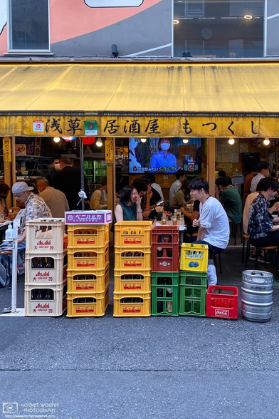 Conversations at a pub in the Asakusa area of Tokyo, Japan.