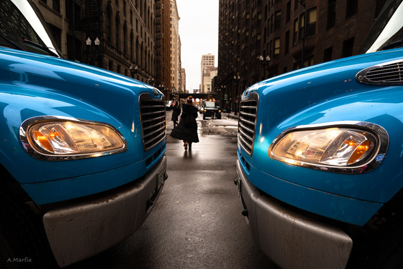 Two trucks block Dearborn Street, Chicago, January 2020. 