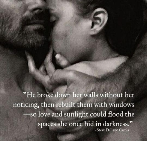 A black & white image of a couple hugging.