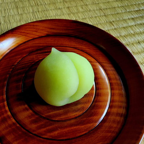 Vivid green sweet mimicking a ripe ume fruit.