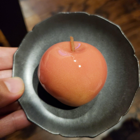 A sweet designed to look like a juicy red apple.