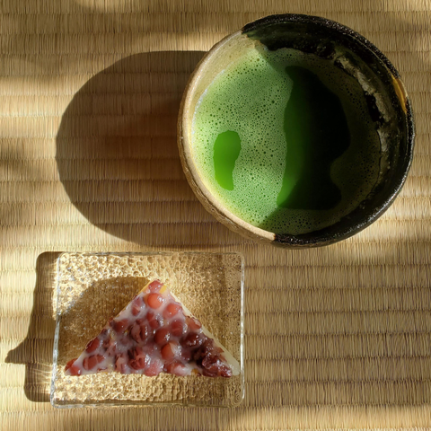 A triangular sweet known as minatsuki. Eaten in the summer months, it is designed to resemble a slice of ice and thus help us think cooling thoughts.