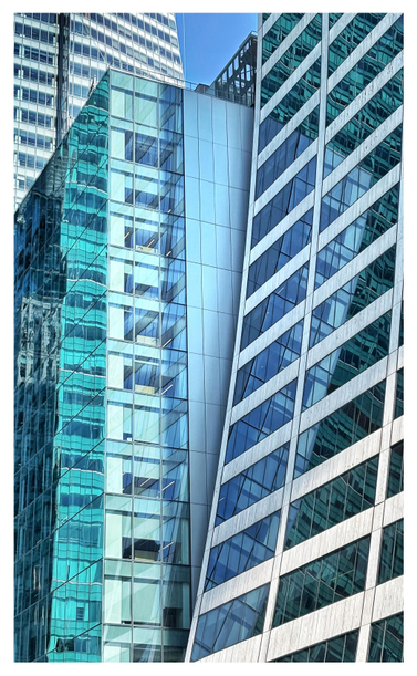 Closeup of a group of buildings on the north side of 42nd Street in Manhattan, across from Bryant Park. The image is predominantly teal and white. In the foreground at right is the Grace Building with its distinctive curved, upward-swooping facade and grid of long horizontal windows. Immediately next to it is the business center Two Bryant Park: we see its side-wall of plain vertical panels bordered by a multi-floor column of wide glass windows, which wrap around to the street-facing facade paneled entirely with reflective glass. In the background at left is the grid of windows of the Bank of America Tower, which rises out of frame. The reflections in the buildings’ many glass panels result in a multiplicity of windows, including those of other buildings across the street. Notably, the curved edge of the Grace Building and some of the other buildings’ vertical lines form an outline suggestive of a long narrow dagger, which descends to its point at bottom frame. A bit of blue sky can be glimpsed at the top.