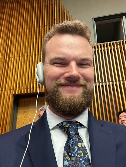 Seth with the translator device on his ear