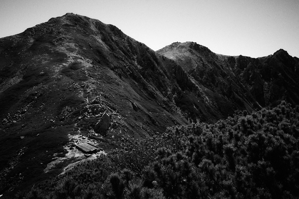 A mountain hut near a peak.