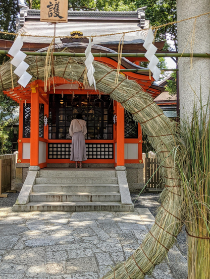 The festival ends in quiet fashion with visitors praying at a small shrine to the god of disease within Yasaka-jinja.