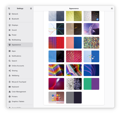 Fedora Silverblue 48.2 shipping all of the GNOME wallpapers.