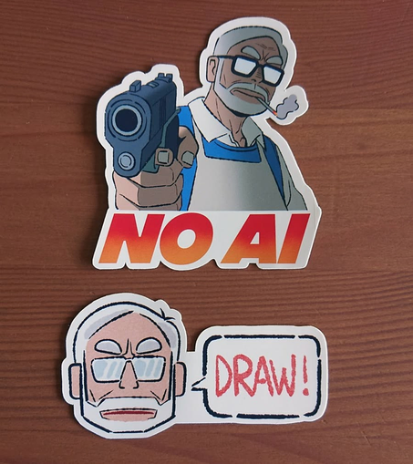 Stickers featuring a cartoon Hayao Miyazaki. The first shows Miyazaki holding a gun pointed at the viewer, with the words NO AI under him. The second is Miyazaki’s head, with a speech bubble that says “DRAW!”