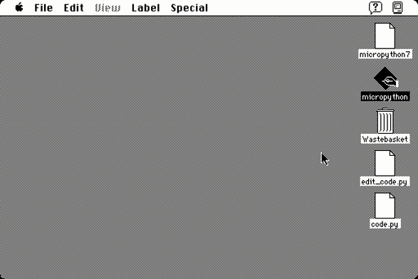 A black & white mac desktop runs micropython. first, the program is run. second, it's edited to change the parameters. then, it's run again. the program draws a moire pattern of lines.