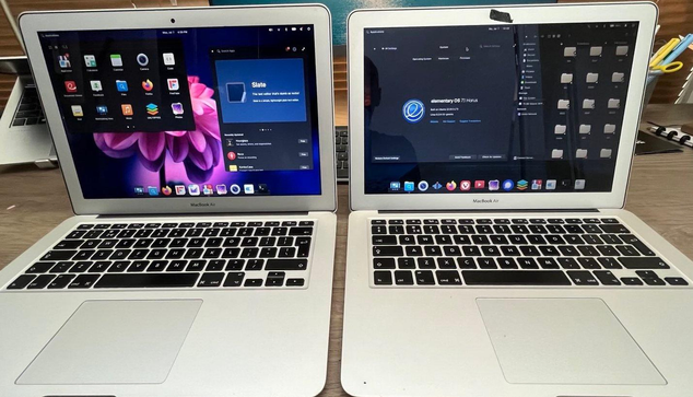 2 open macbook airs displaying the desktop running elementaryOS linux