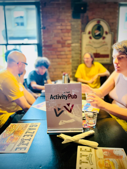 One of the tables at the event with the ActivityPub sign