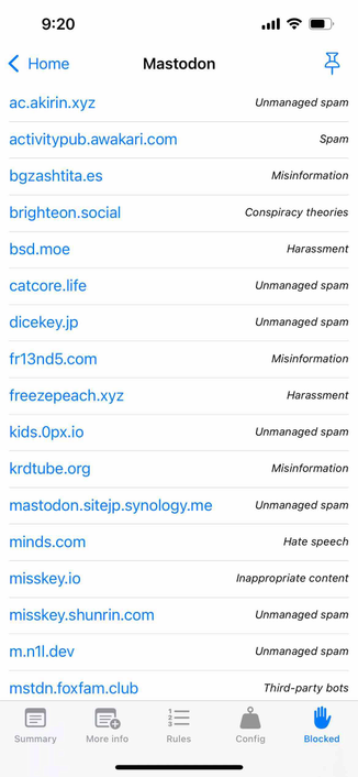 screenshot of an instance view for mastodon.social with five tabs and the blocked tab selected listing domains and the reason for blocking, mostly spam