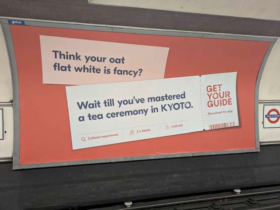 Train ad that reads, "Think your oat flat white is fancy? Wait til you've mastered a tea ceremony in KYOTO."