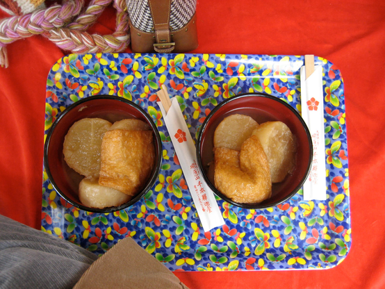 Bowls of boiled daikon and slivers of fried tofu are served during the 'Radish Boiling Festival' (大根焚) at Daihoon-ji.