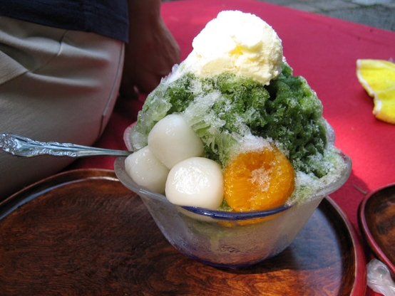 Matcha kakigori, topped with mochi, mikan and ice cream.