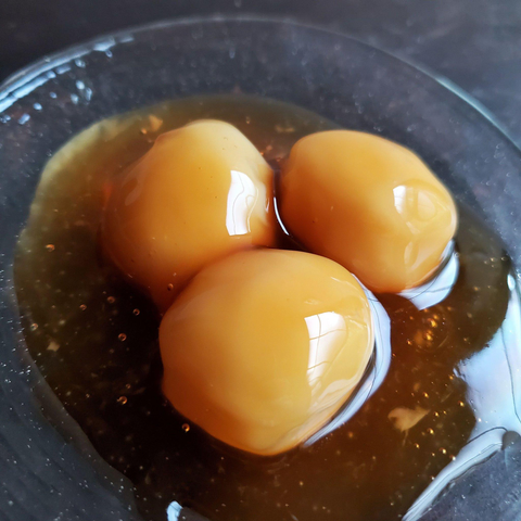 Cold mitarashi dango, here unusually served without a skewer.