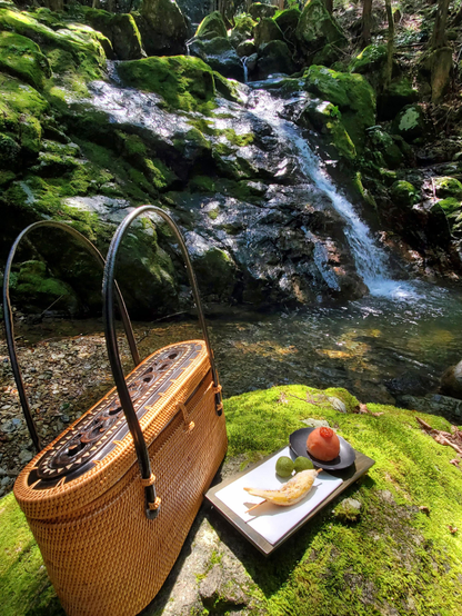 Nao-san's wicker bag, containing everything she needs for an impromptu outdoor tea ceremony.