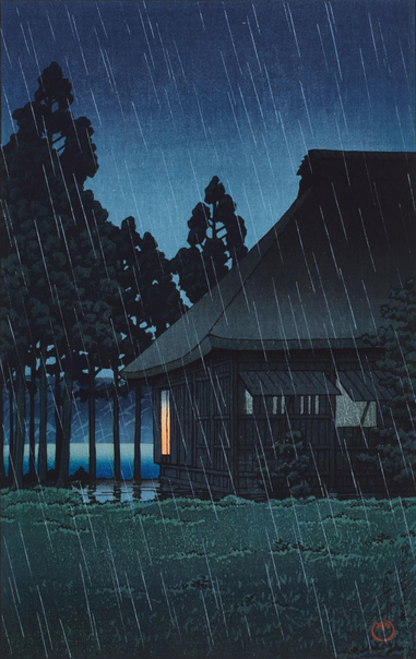 Evening, and a steady rain falls on a small building hosting a tea room standing next to a lake. The ground outside the tearoom is slick with rainwater; a warm light glows in just one of the building's windows. Beyond, a line of trees screens our view of the lake and the hilly terrain on the other side. Above, the sky is dark and overcast.