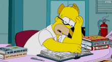 An animated GIF from the Simpsons showing Homer sitting down at a desk and flipping through a book with a look of effort and concentration on his face