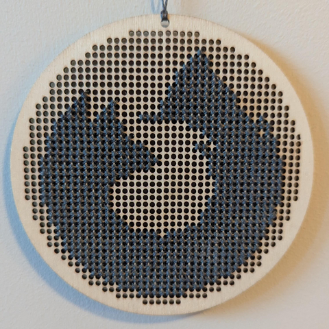 One-colour Firefox logo cross stitch on a wooden canvas.