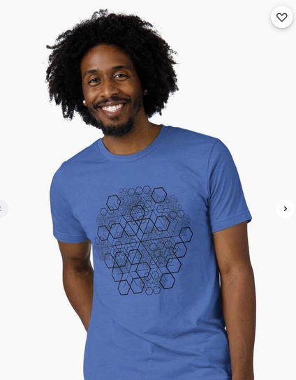 A smiling man with a blue T-shirt with my recursive hexagons drawing (from the redbubble catalog)