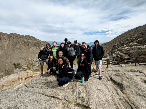 The same peeps posing on a rock in the Rocky Mountains