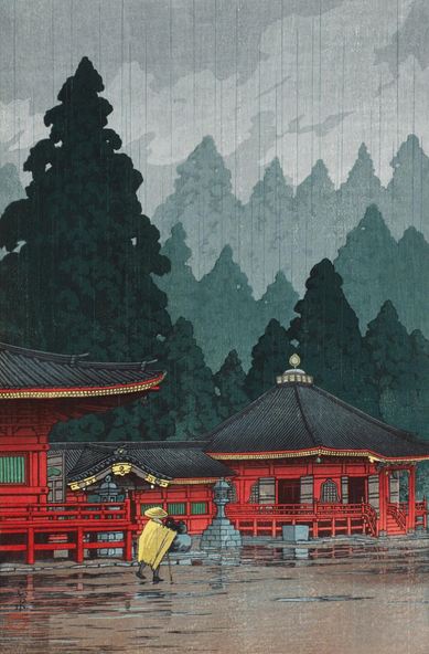 A rainy day at Futatsu-do (or, the Second Hall) at Nikko's Toshogu shrine. In the foreground, a lone figure wearing a broad straw hat and a straw cape crosses the muddy ground; just beyond, the red-lacquered buildings of the shrine are empty and quiet. Further on, tall green trees rise high up above the rooftops of the shrine buildings. Rain continues to fall from an overcast sky.