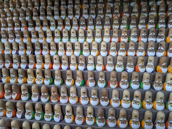 Votive dolls of the god Fukurokuju, left by the faithful at Sekizanzen-in. He is the god of wisdom, luck, longevity, wealth and happiness.