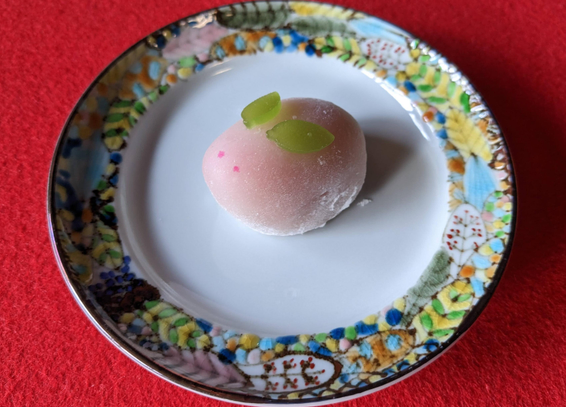 A cute little pink mochi rabbit (with green ears!).