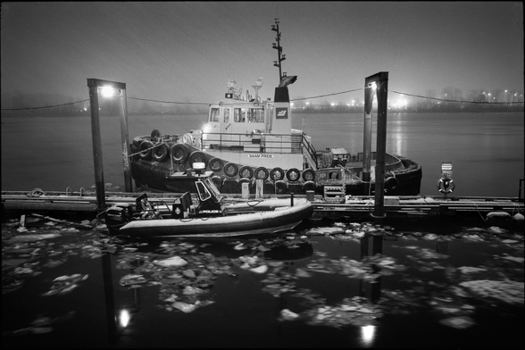 Boats moored on the Fraser River on a blustery winter evening.