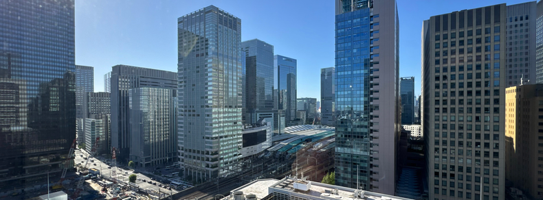 From an office building in the Otemachi area of Tokyo, Japan, a view towards Tokyo Station and surrounding high-rise buildings.