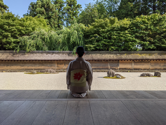 Nao-san contemplates the dry landscape garden at Ryoan-ji.