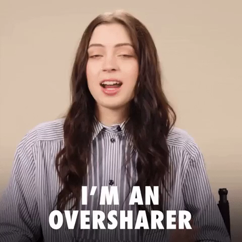 Young woman with long brown hair and a striped shirt speaks against a beige background. Text overlay reads, "I'm an oversharer." Her expression is open and relaxed.
