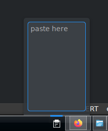 A screenshot of a bottom panel with a paste icon, from which a text area emerges.
