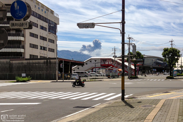 Mt. Sakurajima volcano doing its thing, as seen from downtown Kagoshima, Japan.