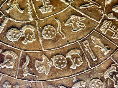 Detail shot of the Phaistos Disc, a presumably Minoan artifact from the second millennium BCE, found in southern Crete in 1908.

In the picture, many pictographic characters from the spiral track on the as-yet-undeciphered disc are visible, such as shields, eagles, horns, combs, tuna fish, and more.

The "plumed head" character is seen at least four times in this small inlay, indicating that punk rock was very important to Minoan culture.