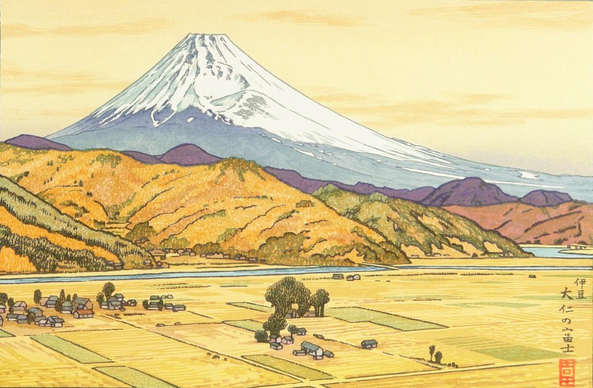 An autumn afternoon in rural Japan. In the foreground, the crops have been harvested and the fields are flat and gold-coloured, with a few farmhouses scattered over the plain. Just beyond, a river draws a thin blue line between the farms and foothills covered in trees turning gold, orange and brown with the season. Further on, Mount Fuji rises above the foothills, details of the mountain's base lost in bluish haze, its snowy peak standing out cold and white against the warm gold and orange hues of the sky.