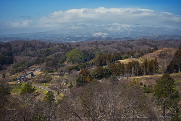 Top of a castle hill, looking at snow mountains