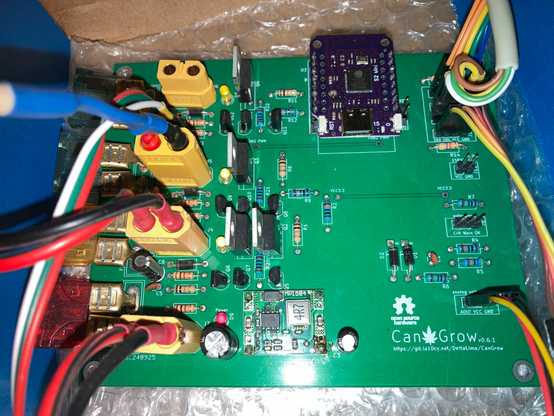 green CanGrow v0.6.1 PCB, assembled and plugged in, with many cables and a purple ESP32-S2 mini in the socket.