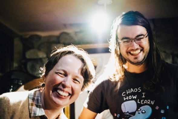 Nerd Nite speakers Elizabeth Tasker and Guillaume Pelat share a joke with the camera.