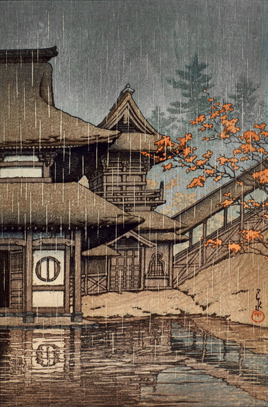 Autumn rain falls on a quiet mountain temple. On our left stands a temple building, the open front door revealing shadows within; just past and on the right is a bell tower, shuttered against the elements. A tree, its branches carrying a thinning batch of orange leaves, reaches out over the puddles forming in the uneven courtyard; just beyond the temple are the shadows of more trees. Above, the sky is slate-gray and overcast, and rain continues falling steadily across the scene. The space seems deserted and still, with no humans visible.