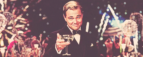 The famous meme animation from "The Great Gatsby" of Leo DiCaprio raising a champagne glass towards the viewer.