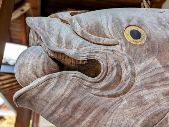 The ball in the kaipan's mouth represents bad mental states.