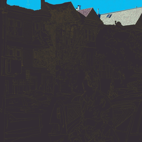 The gray background with an intricately outlined San Francisco street decorated for Halloween now has a blue sky and two roofs lit by the bright light of late afternoon.