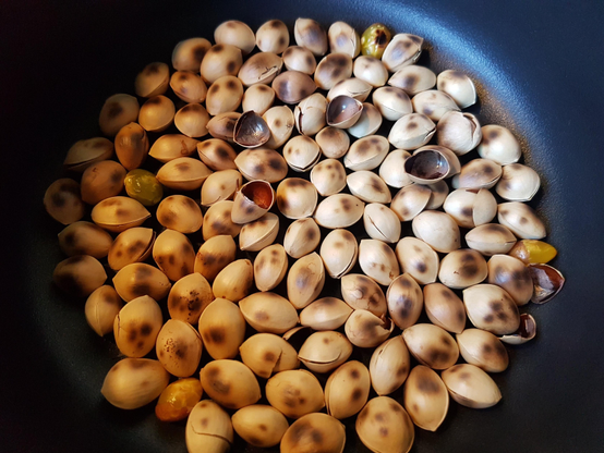 Cooking ginnan in a frying pan.