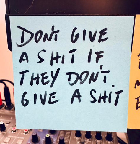 An updated post-it note saying “don’t give a shit if they don’t give a shit”