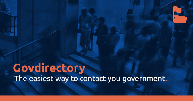 A mood image with many people moving through a public building. Text on top is: "Govdirectory The easiest way to contact your government."